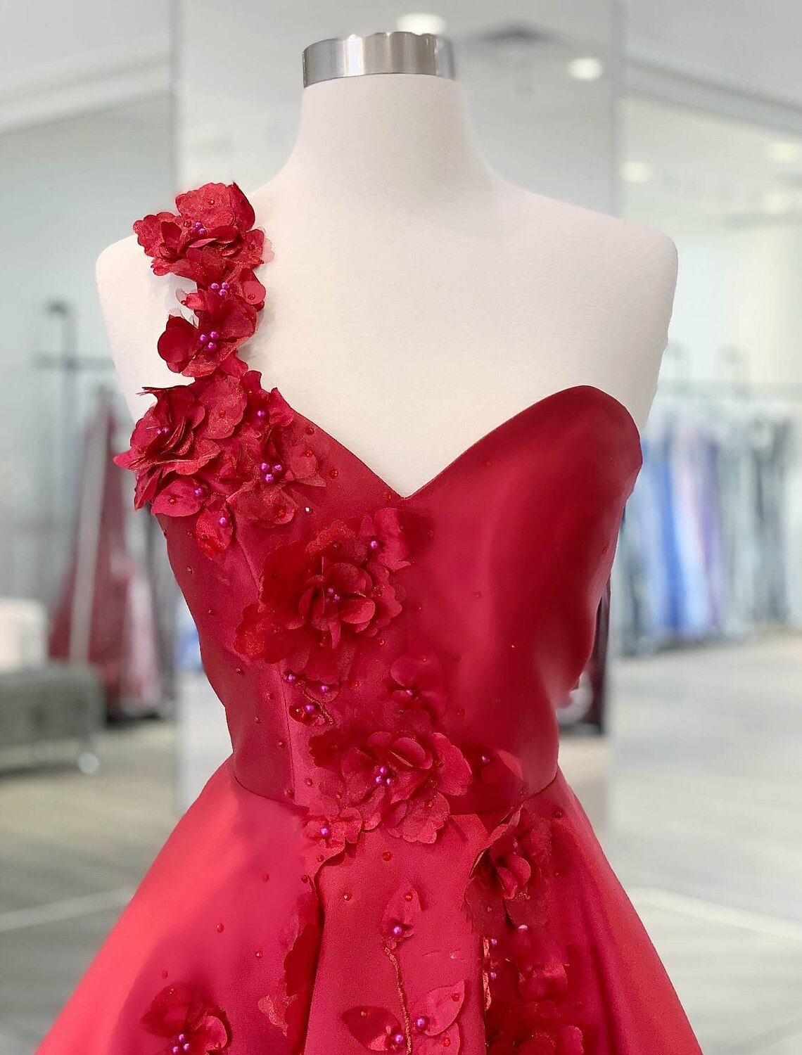 Side view of the A-line one-shoulder satin short dress, showing the silhouette.