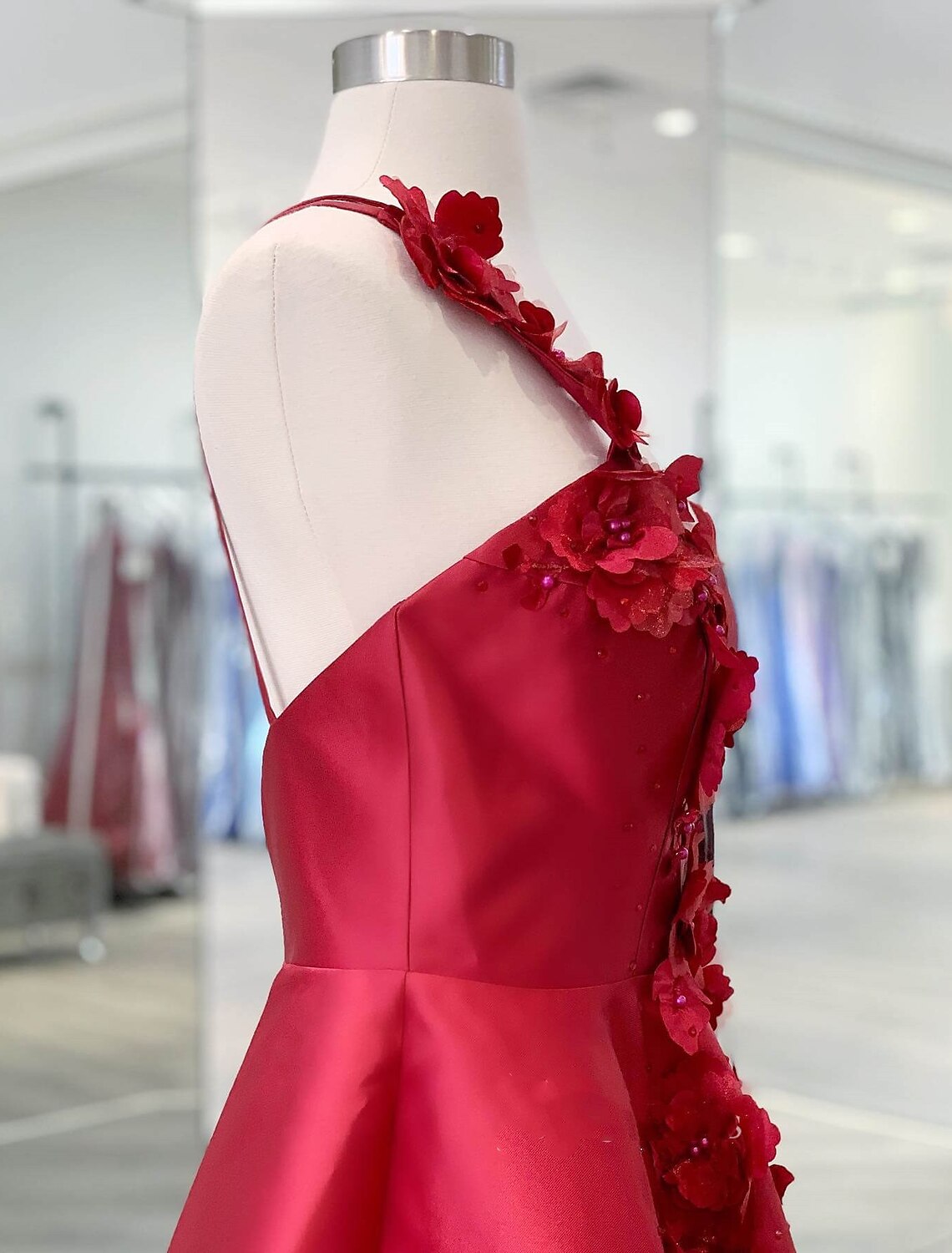 Back view of the A-line one-shoulder satin short dress, highlighting the backless design.