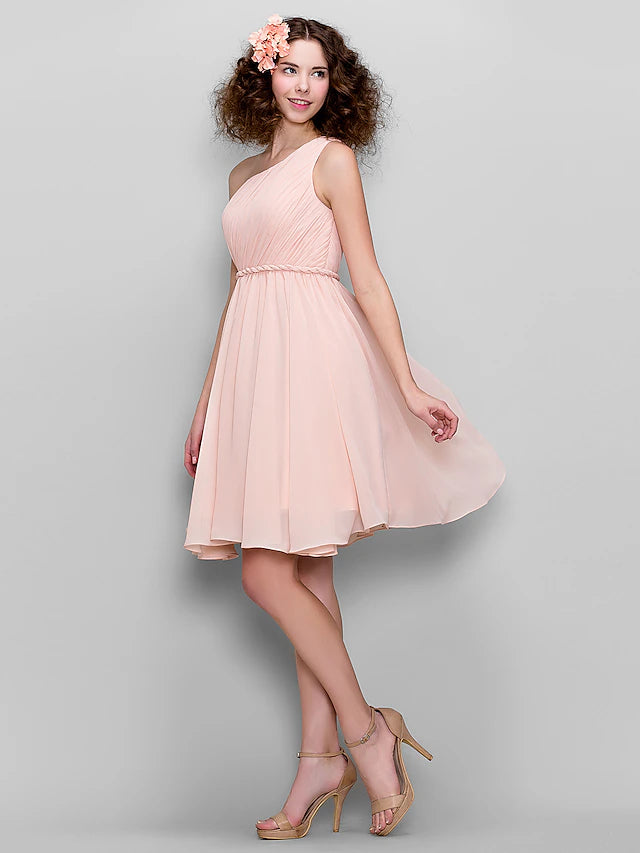 Detail of the side draping on a knee-length chiffon dress.
