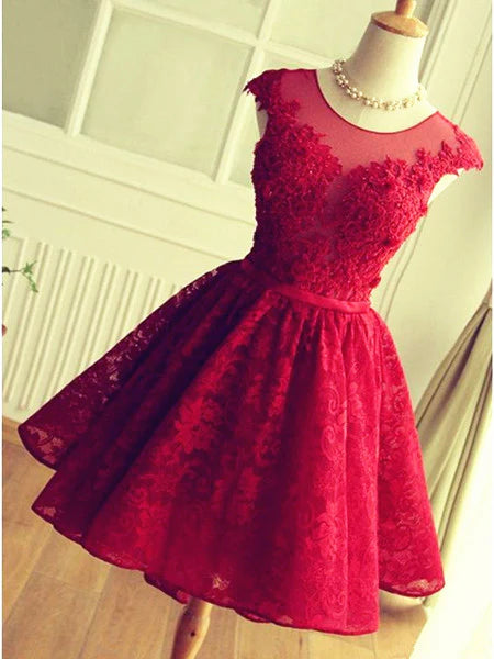 Model wearing a short A-line round neck lace dress.