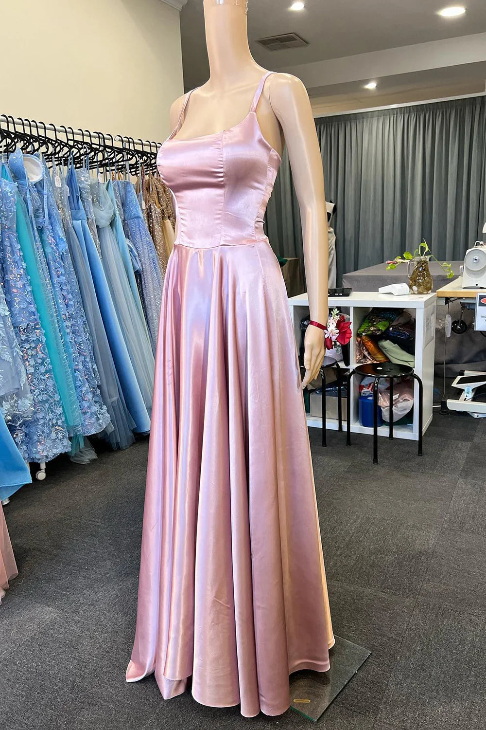 Elegant light pink A-line long prom dress with spaghetti straps.