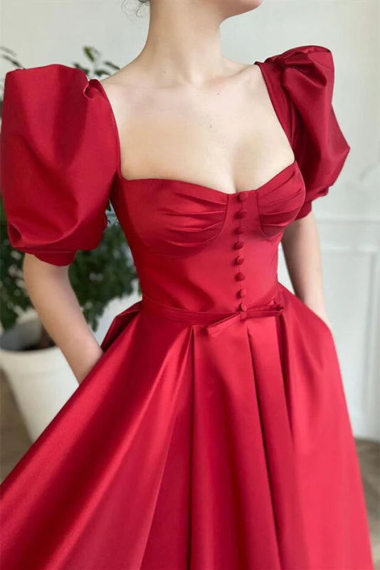 Full view of a short A-line prom dress featuring a square neckline and short sleeves.