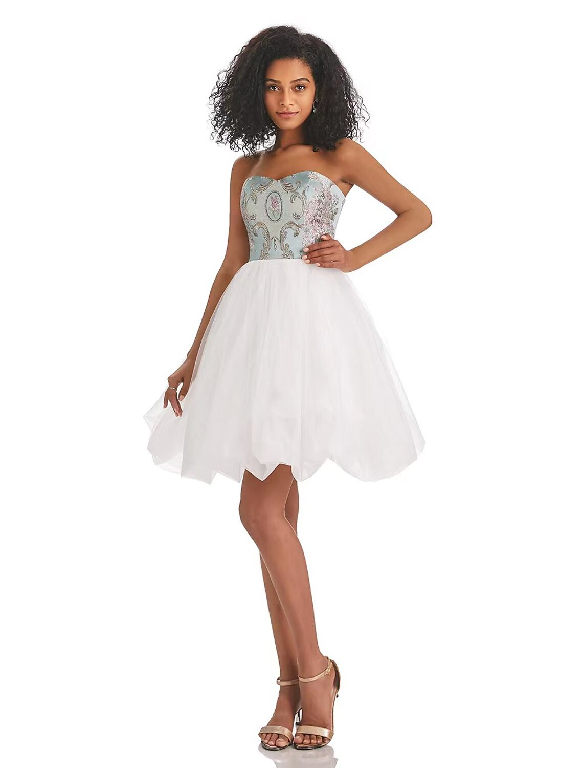 Model wearing a strapless A-line color block tulle dress.