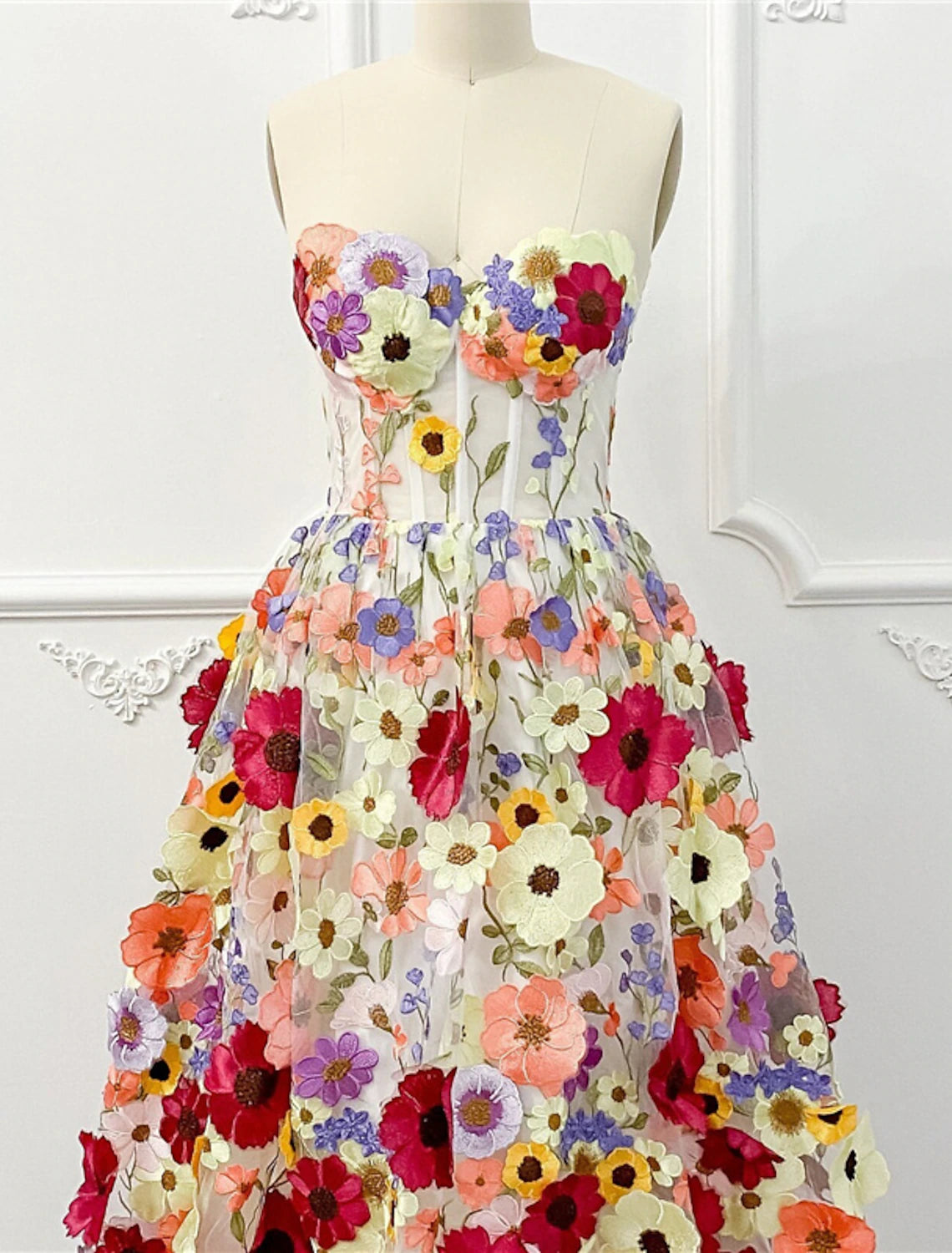 Side view of a-line strapless floral dress.