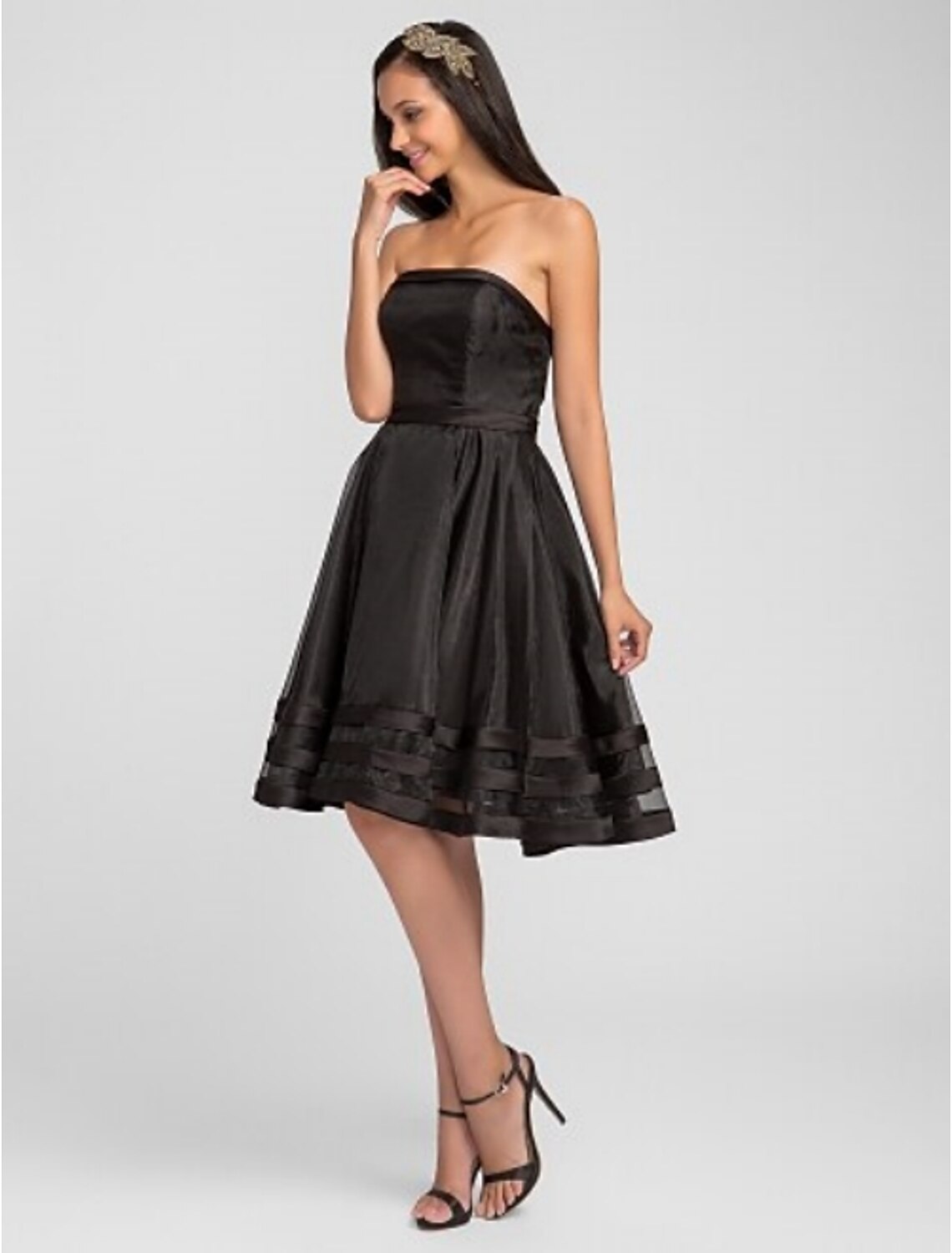Full length view of an elegant organza bridesmaid gown.
