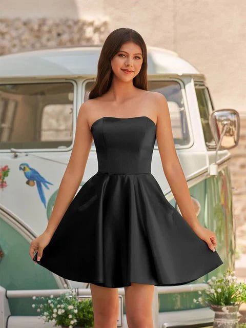 Model posing in A-line satin dress, showing pockets.