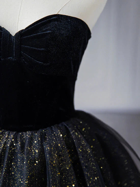 Side view of the A-line strapless prom dress with flowing tulle.