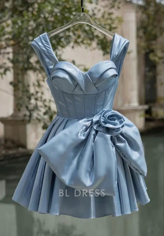Woman in a short blue A-line sweetheart formal dress.