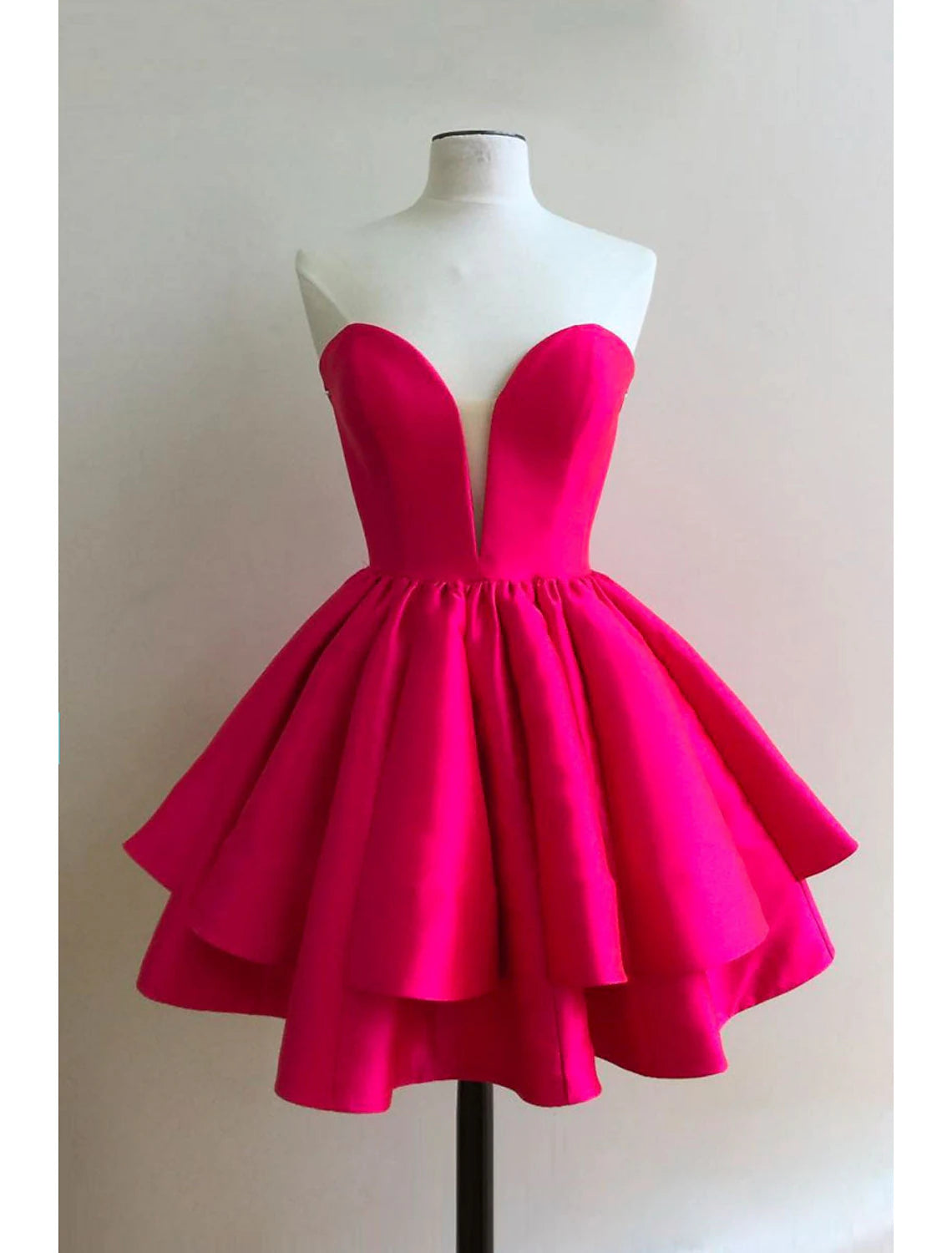 A-line sweetheart satin homecoming dress with backless design and ruffles.