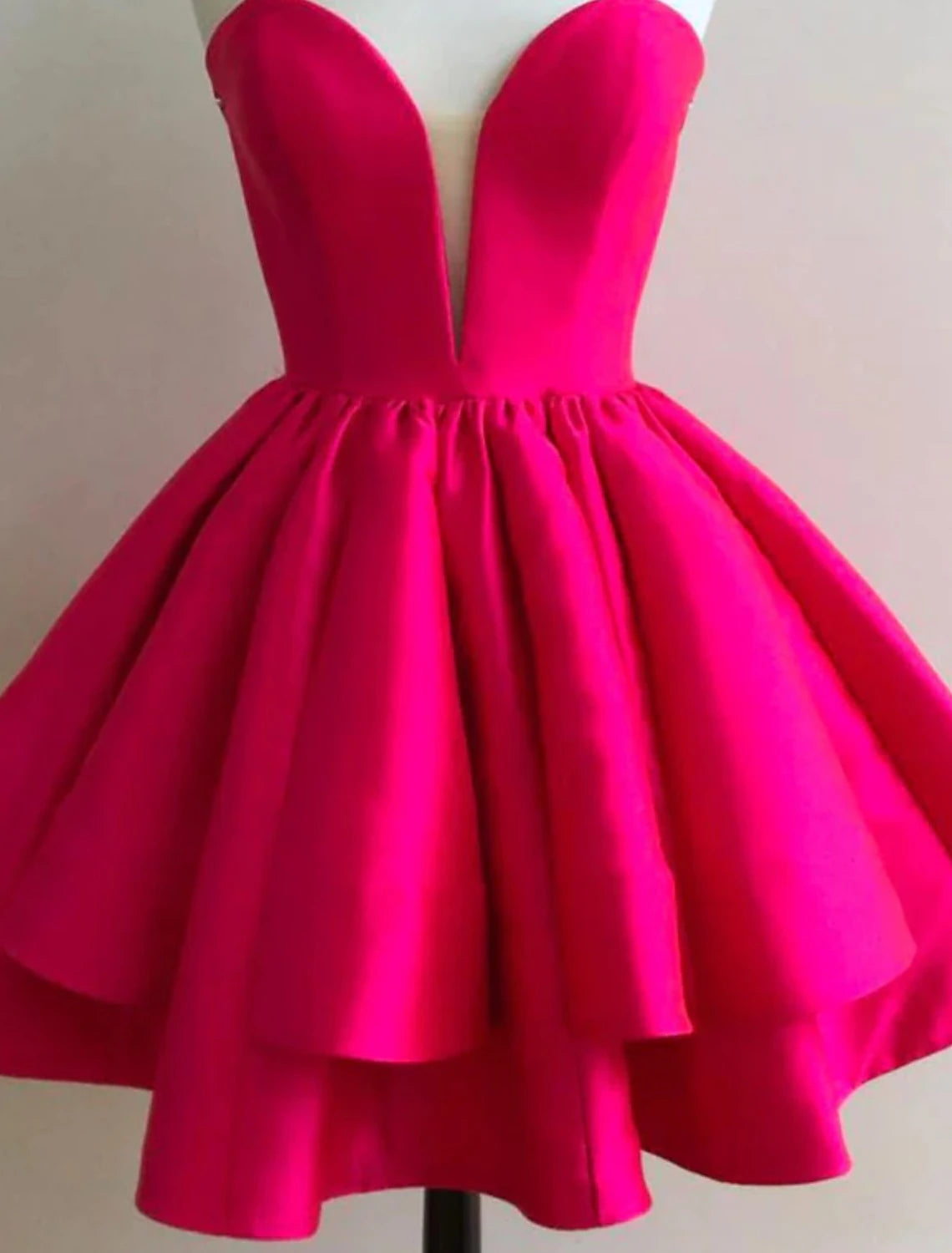 Front view of a short A-line satin dress with sweetheart neckline.