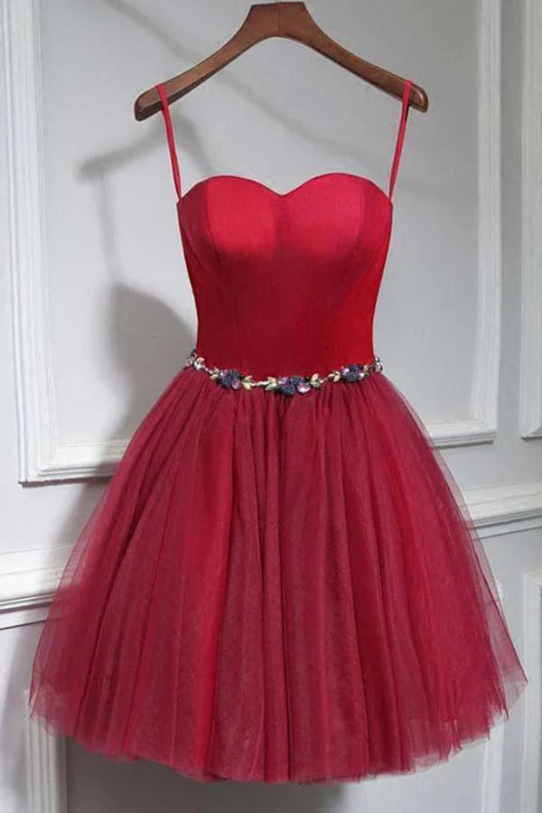 Model wearing a chic A-line short homecoming dress with sweetheart neckline and short sleeves.