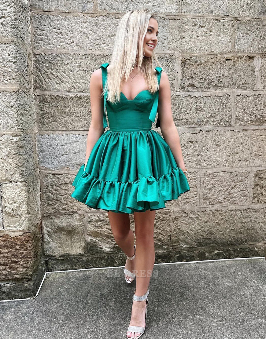 Side view of a green A-line sweetheart tie-strap short satin dress.