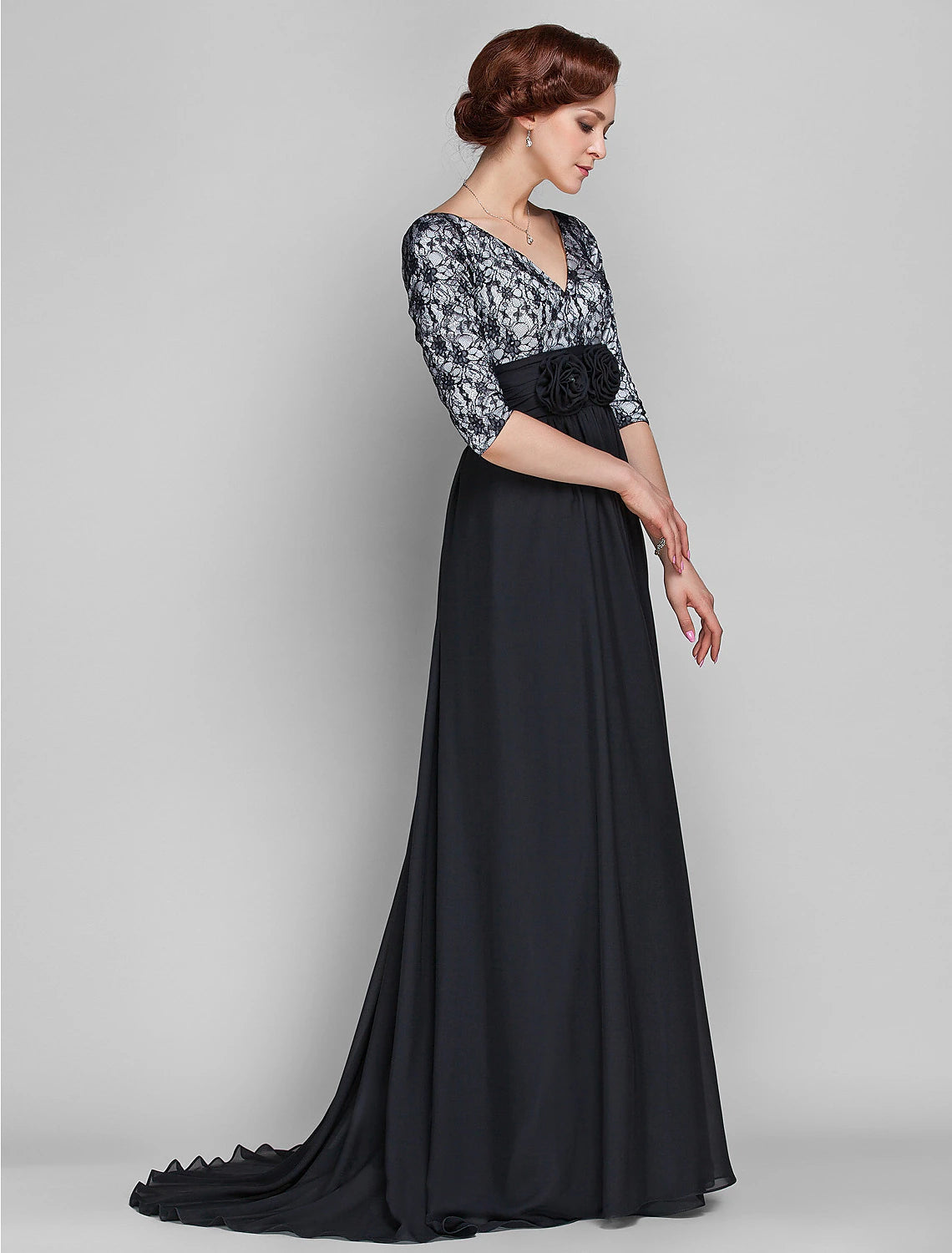 Back view of the Mother of the Bride dress showing lace details and train.