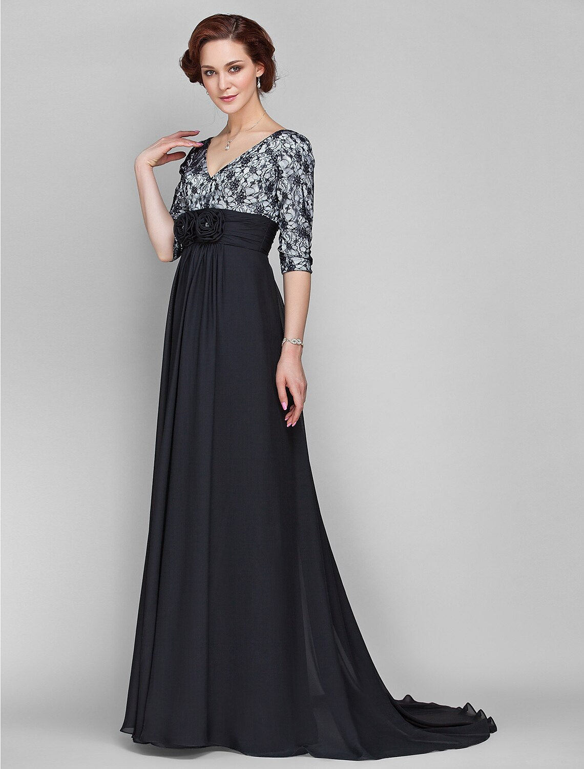 Close-up of the V-neckline and delicate half sleeves on the formal dress.