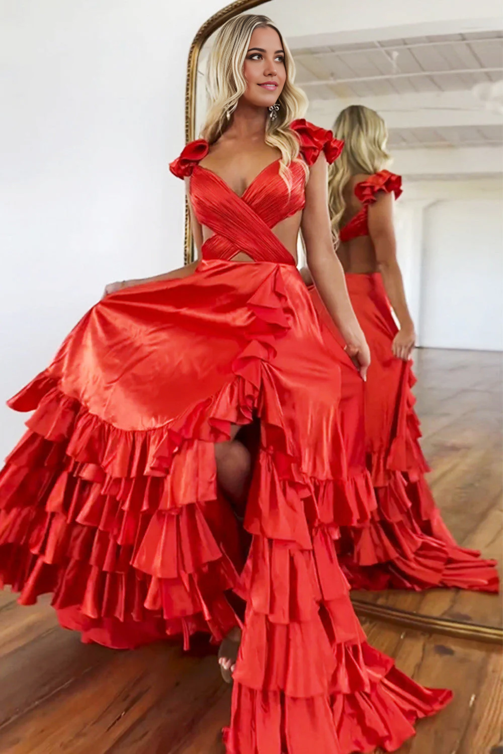 Back view of the elegant red prom dress, showcasing the flowing tiered skirt.