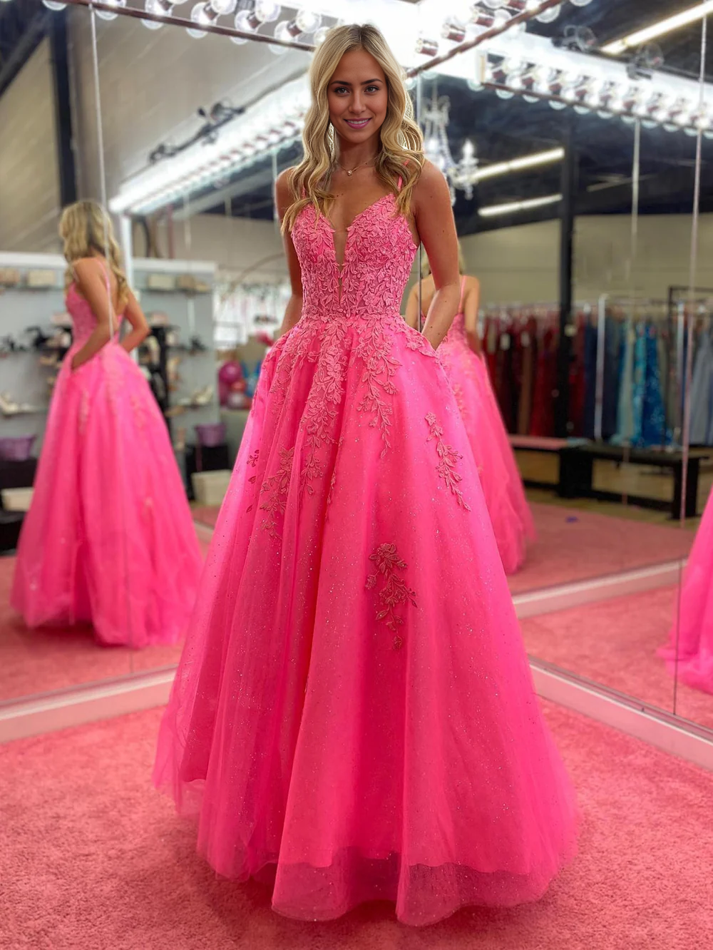 Full length view of the A-line V-neck lace prom dress.