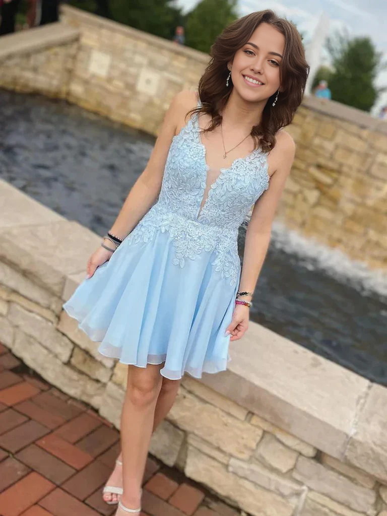 Side view of a woman in an elegant V-neck prom dress.