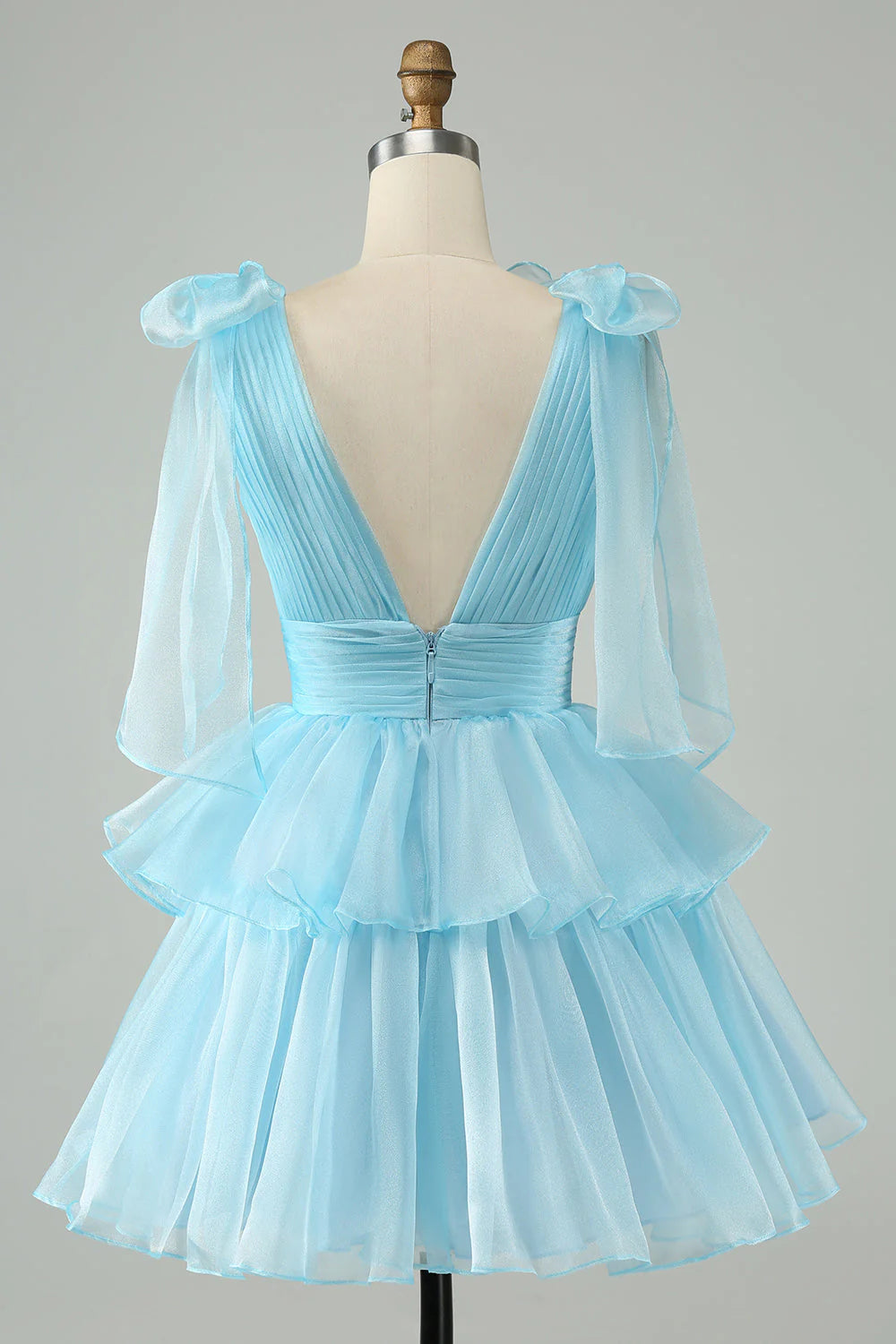 Back view of A-line V-neck pleated tiered short homecoming dress.