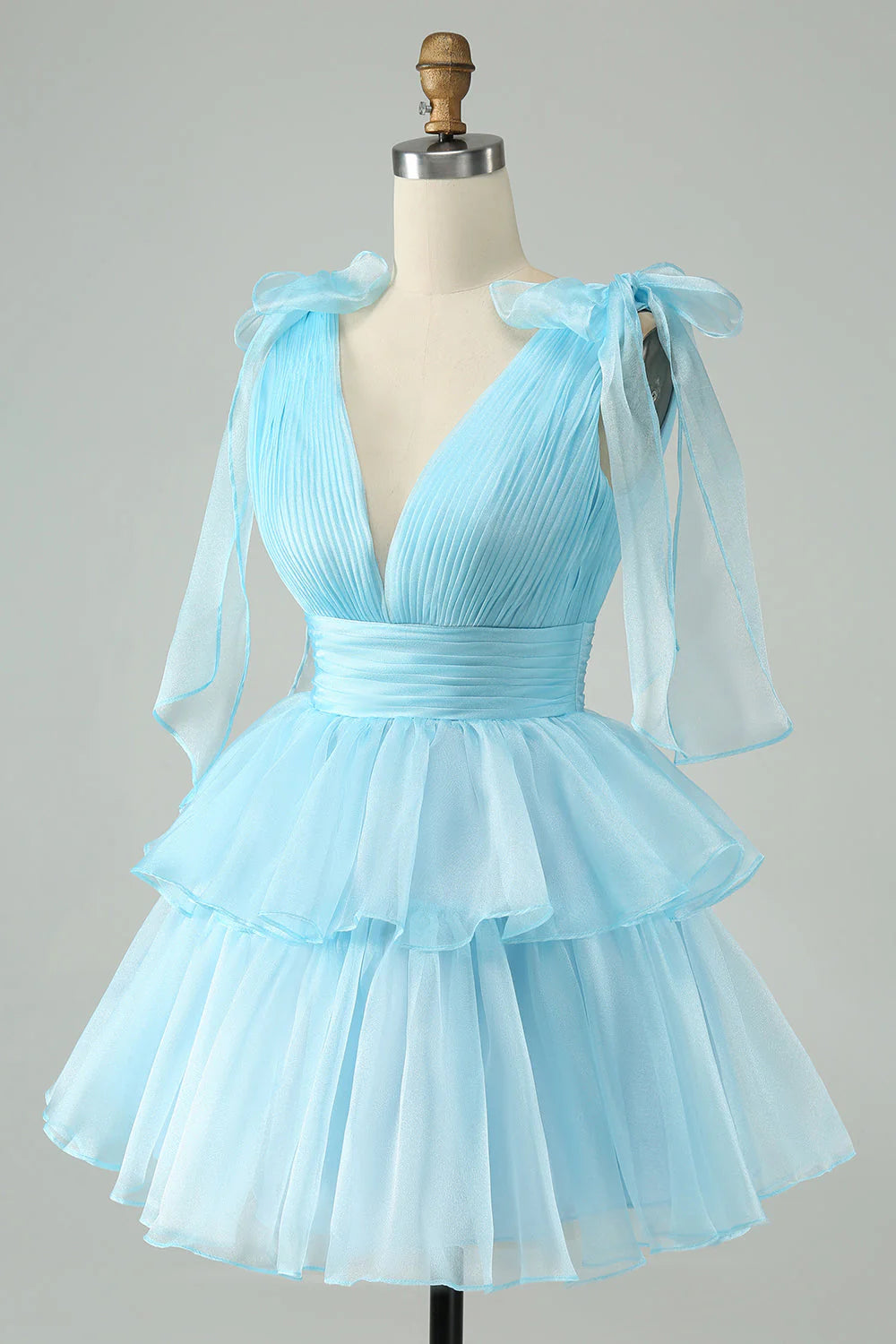 Side view of A-line V-neck pleated tiered short homecoming dress.