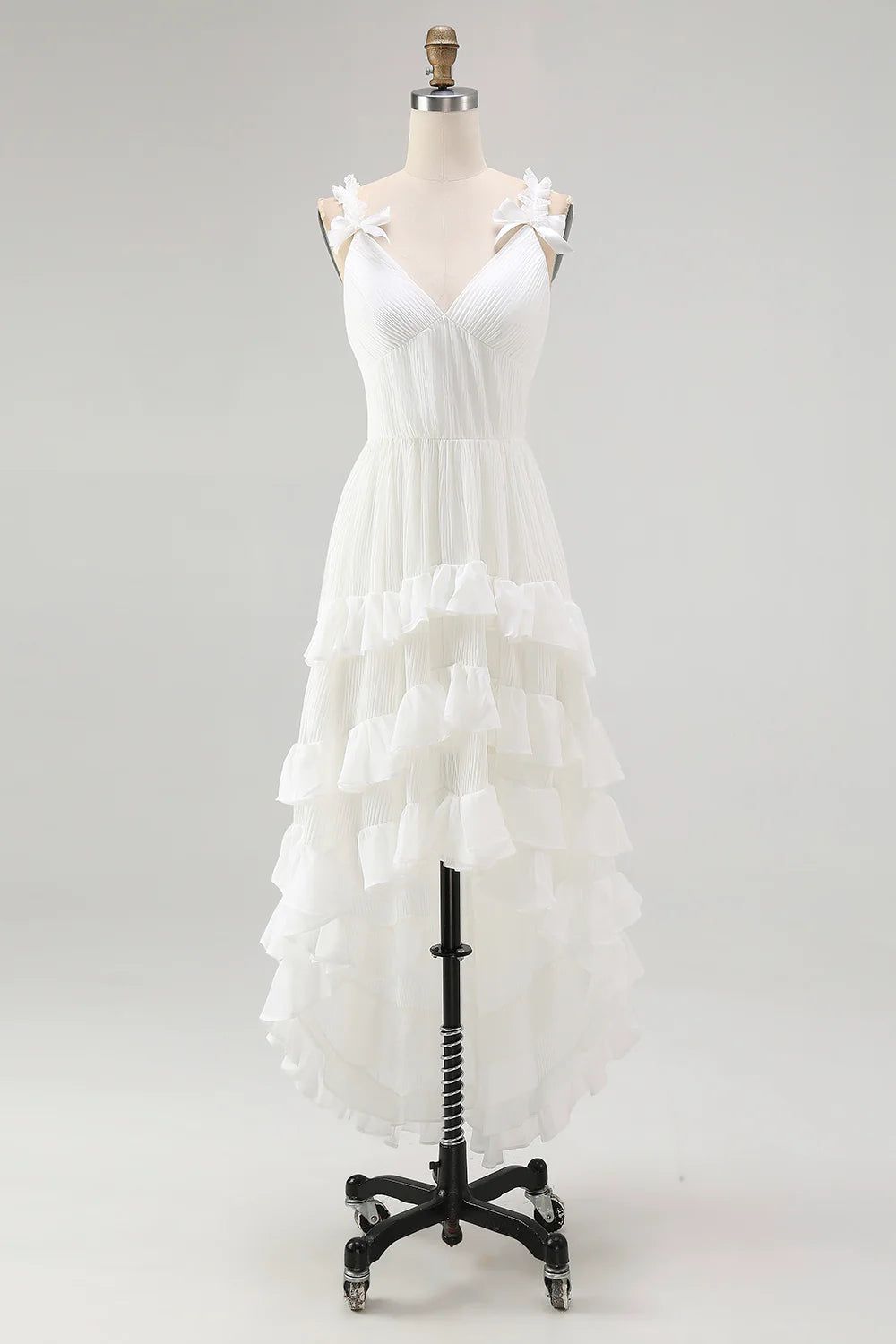 Side profile of the Ivory high-low tiered wedding gown.
