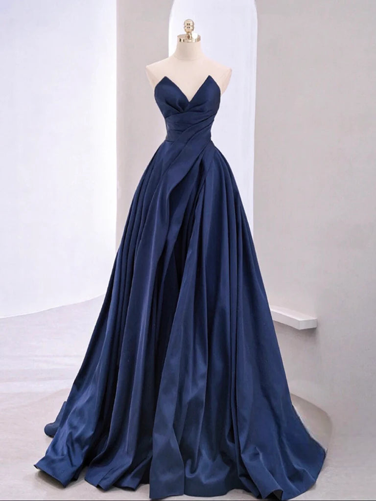 Woman wearing an elegant A-line V-neck sleeveless satin long prom dress.