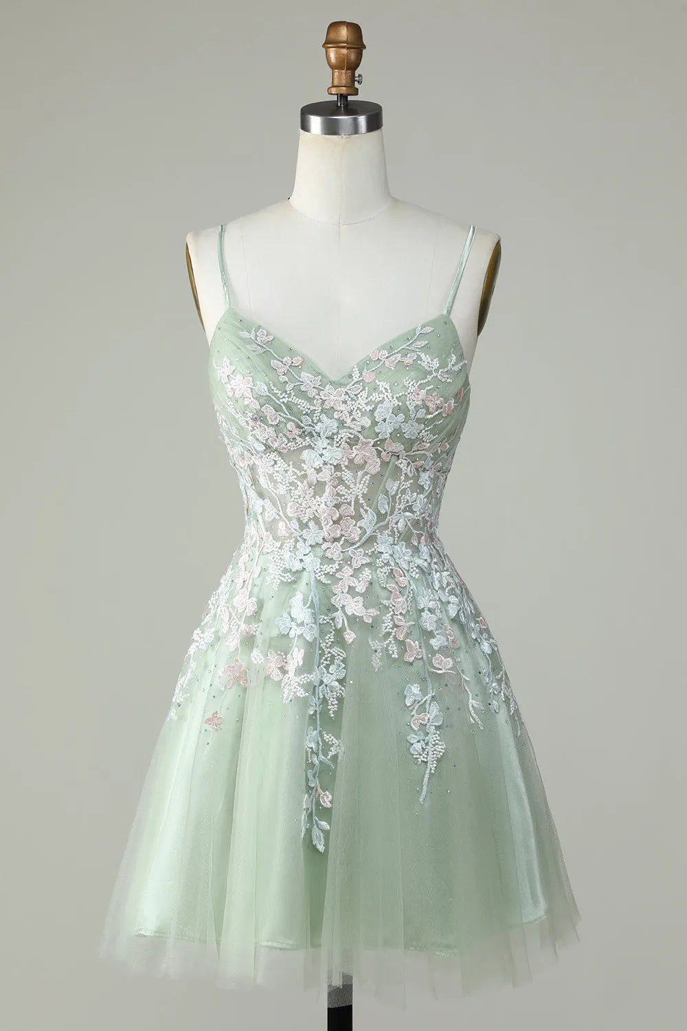 Front view of a short A-line V-neck homecoming dress with spaghetti straps.