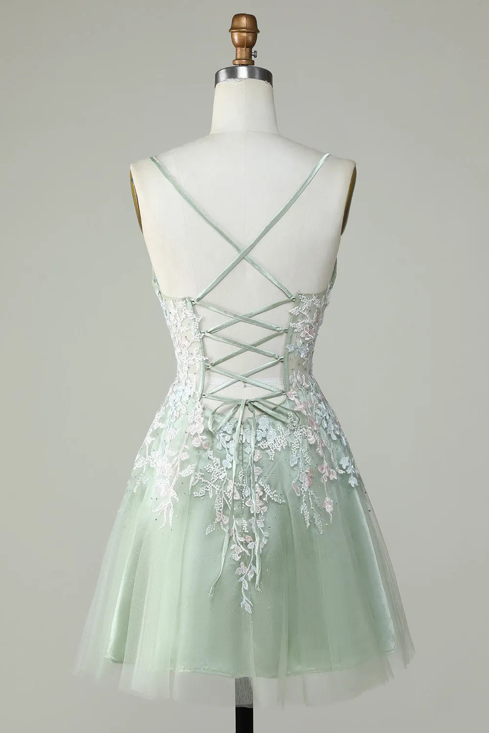 Side view of the short A-line V-neck homecoming dress with spaghetti straps.
