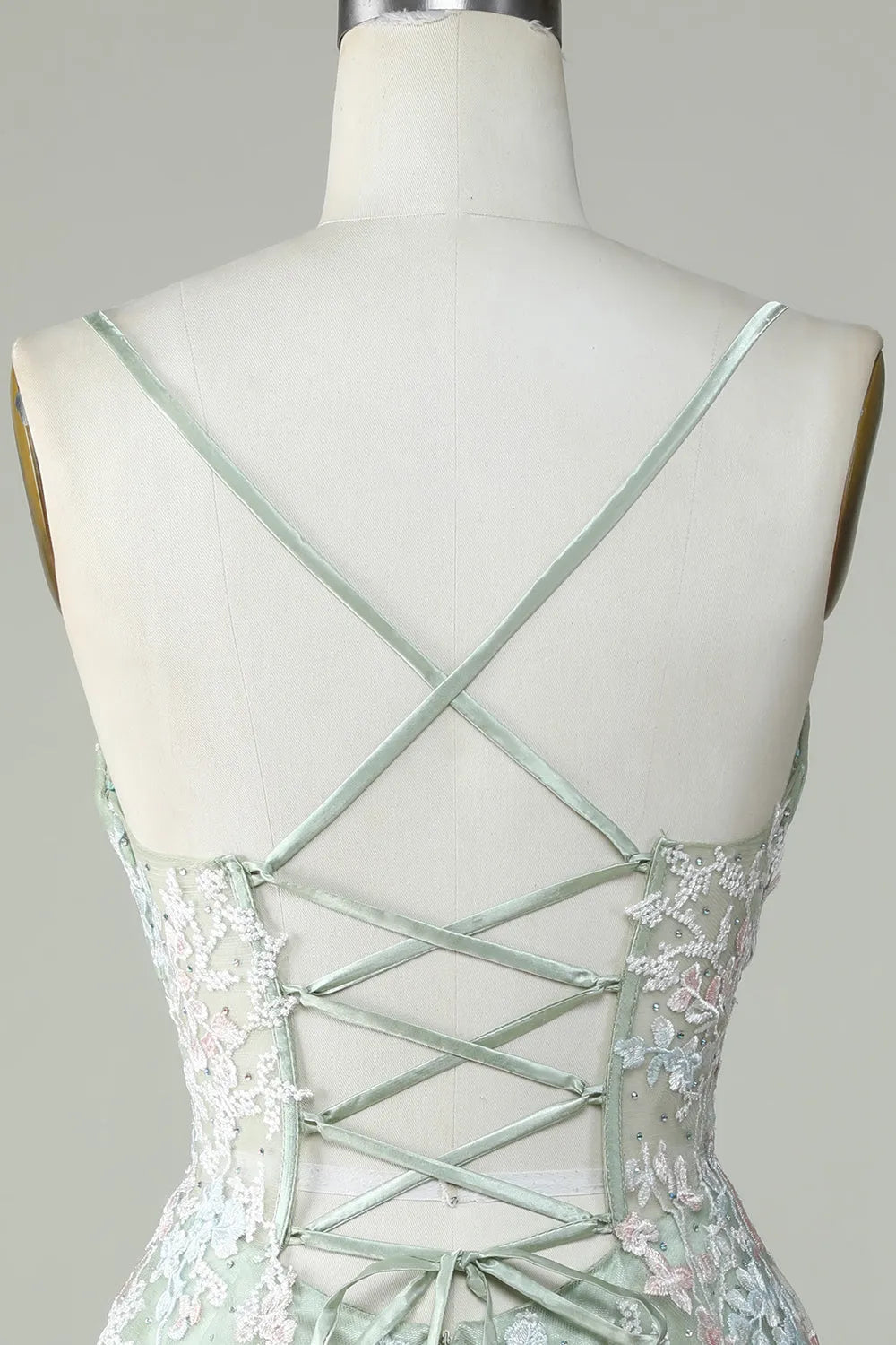 Close-up of the V-neckline and spaghetti straps on the homecoming dress.