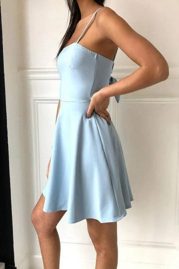 Back view of a light blue A-line satin homecoming dress with spaghetti straps.