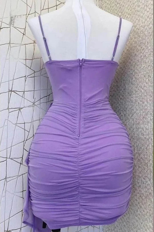 Back view of a chic A-line V-neck pleated mini dress with spaghetti straps.