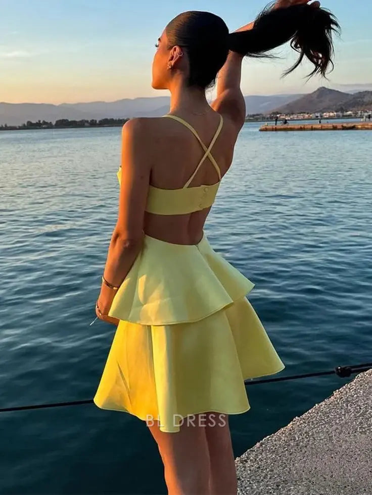 Side view of a model showcasing the elegant silhouette of the yellow A-line formal dress.