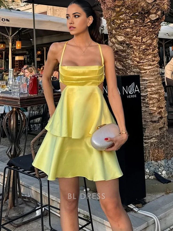 Back view of a model in the yellow A-line spaghetti strap dress, ideal for special occasions.