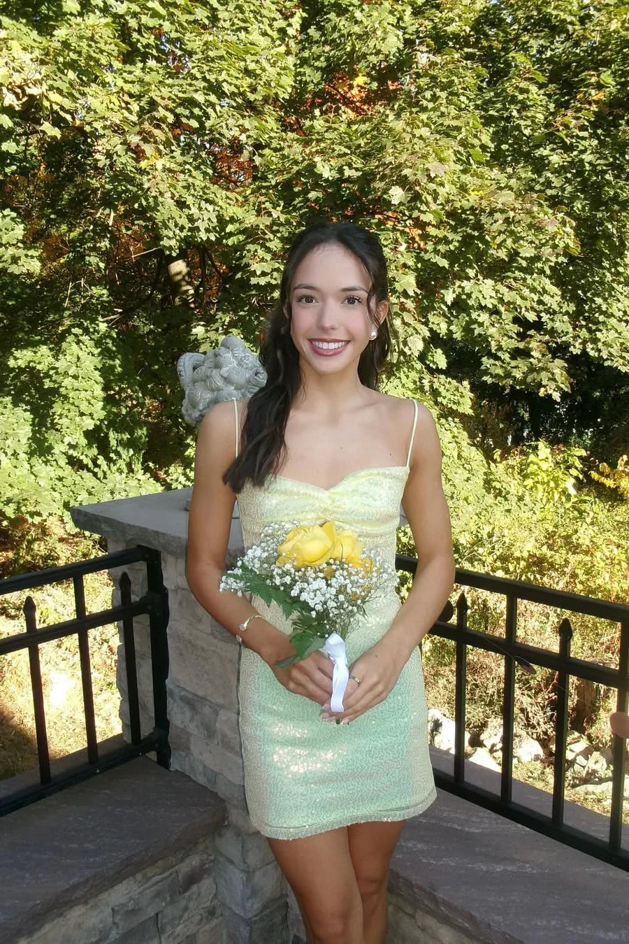 Yellow short A-line dress with spaghetti straps, twist front, and keyhole detail.