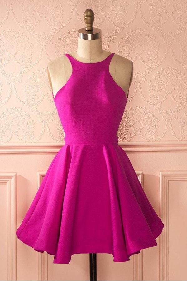 Model wearing a hot pink A-line backless short homecoming dress.