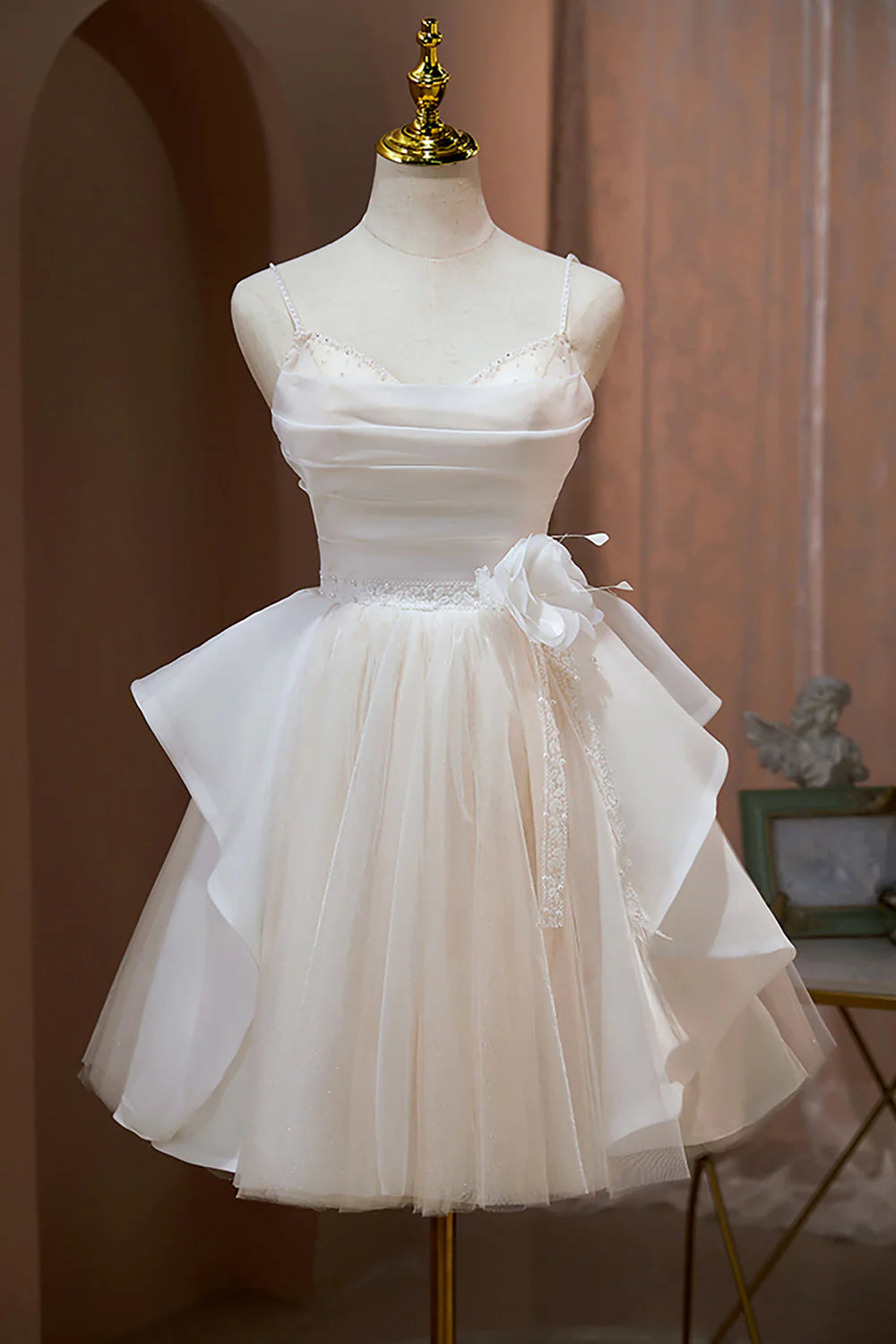 Back view of a light blue A-line tulle dress, perfect for homecoming.