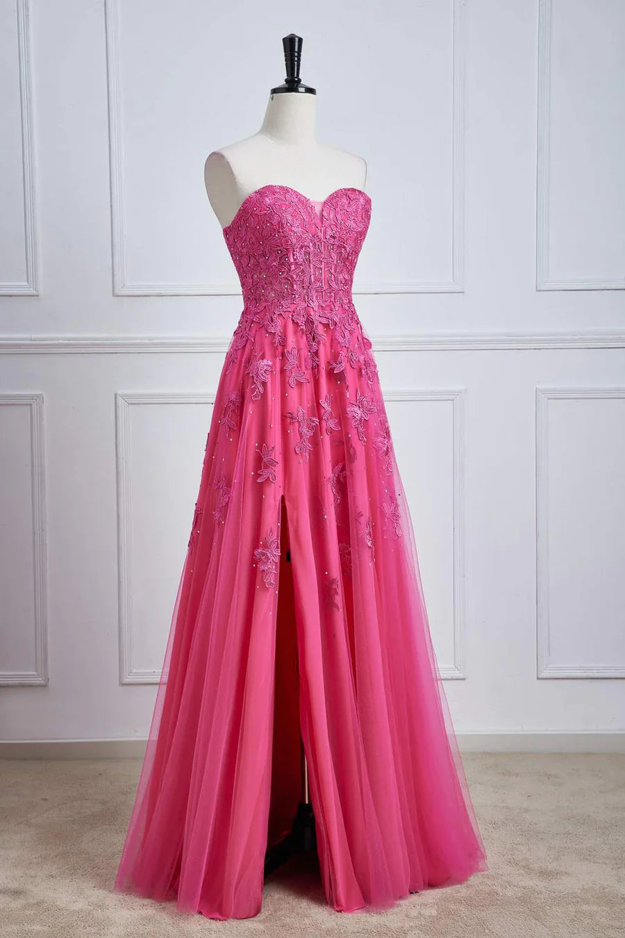 Elegant fuchsia strapless A-line formal gown.