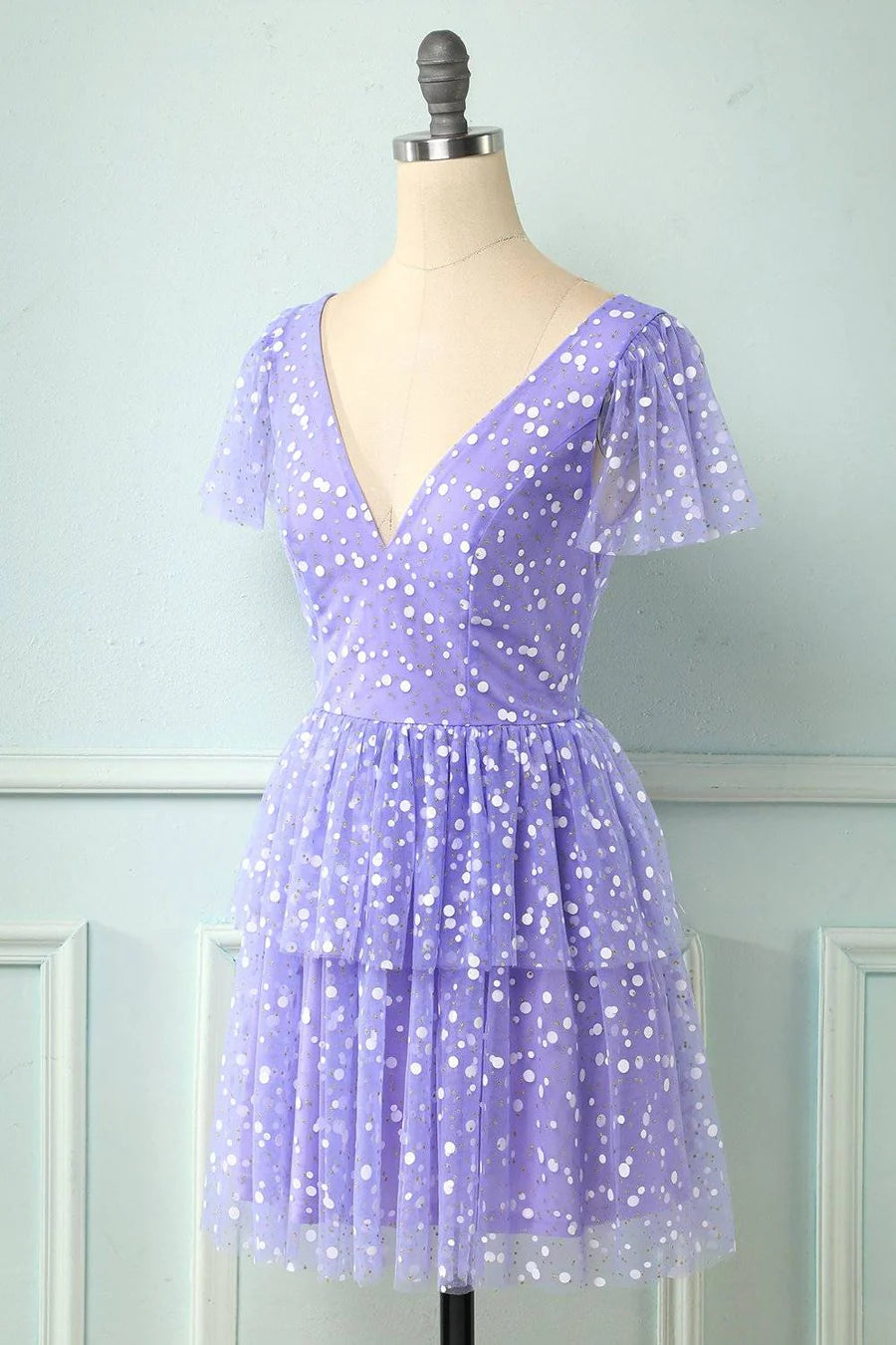 Back view of the dotted multi-layered mini homecoming dress.