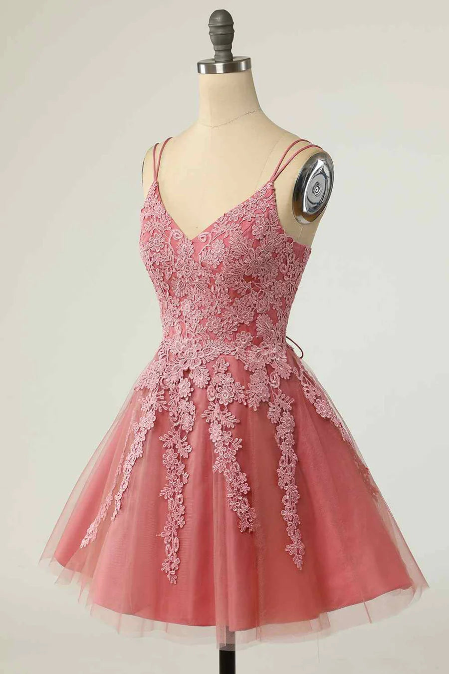 Close-up of the V-neckline and applique details on the dress.