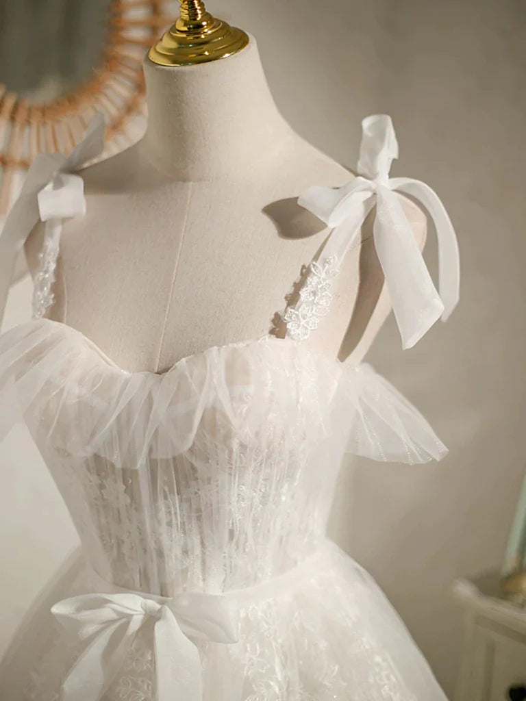 Close-up of the delicate lace fabric on the A-line V-neck mini dress.