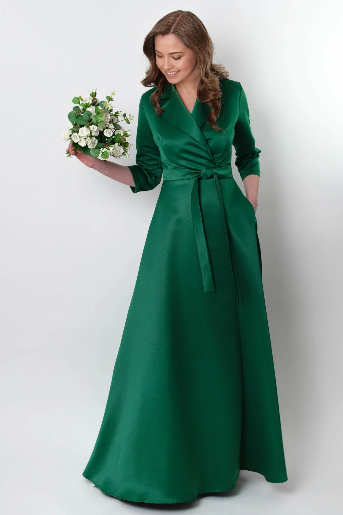 Back view of a woman in a long sleeve V-neck bridesmaid dress.
