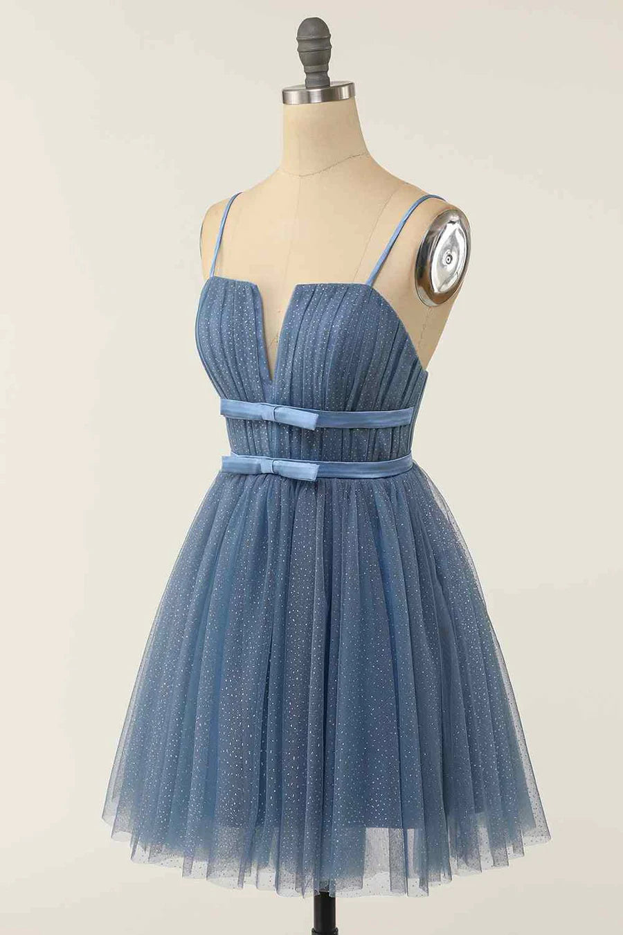 Side view of the A-line V-neck pleated homecoming dress, highlighting the skirt and sash.