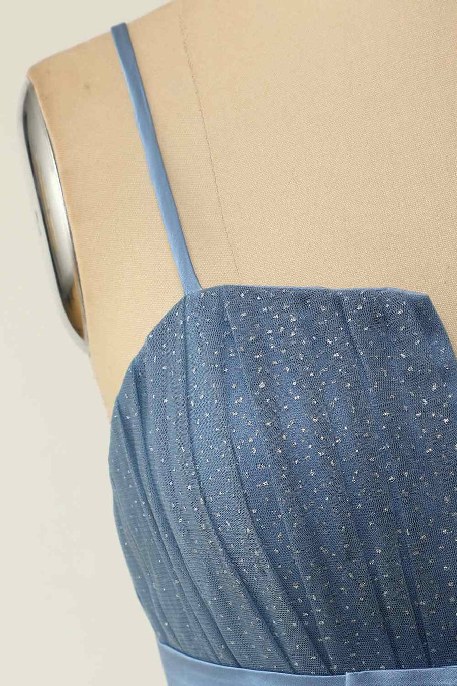 Close-up of the V-neckline and pleated bodice of the homecoming dress.