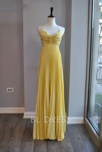 Yellow A-line V-neck pleated formal dress.
