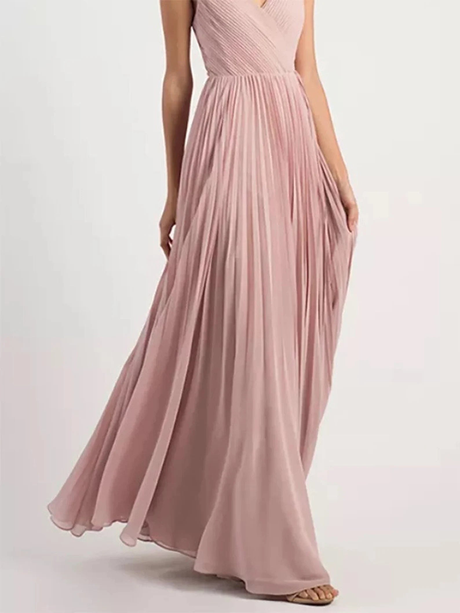 Close-up detail of the V-neckline and spaghetti straps on the formal dress.