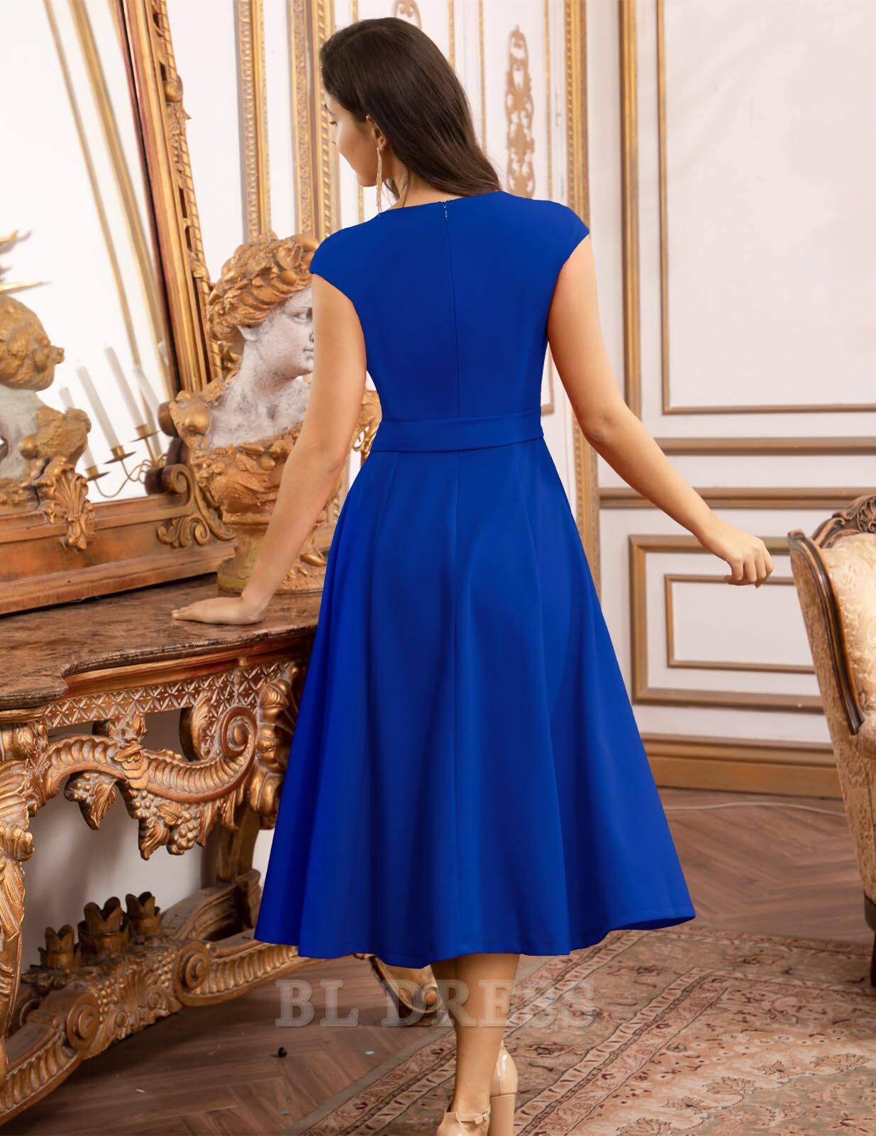 Side view of an elegant A-line V-neck tea length formal dress.