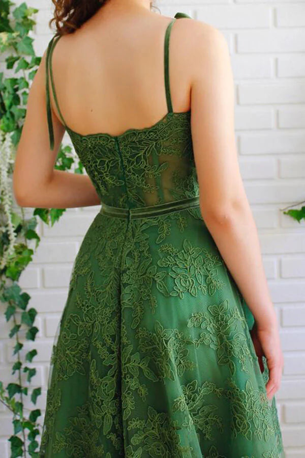 Back view of dark green A-line prom dress with spaghetti straps.
