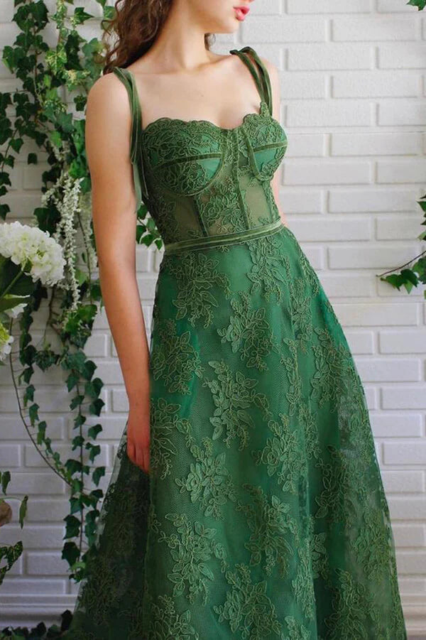 Side view of elegant dark green A-line tulle lace gown.