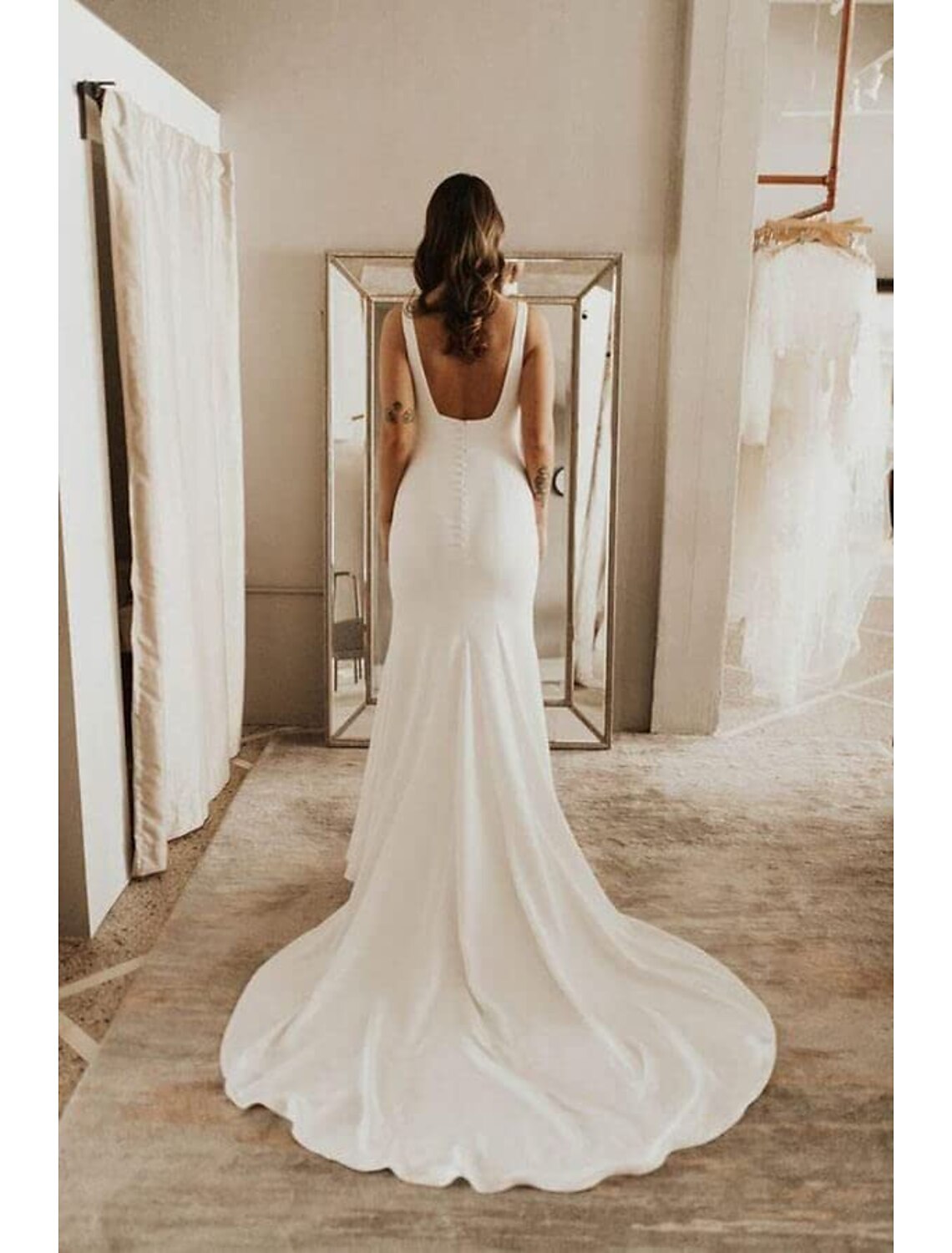Detail of the camisole neckline on the stretch fabric wedding dress.