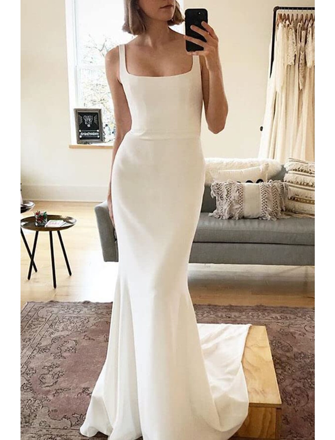 Side view of the elegant beach boho wedding dress silhouette.