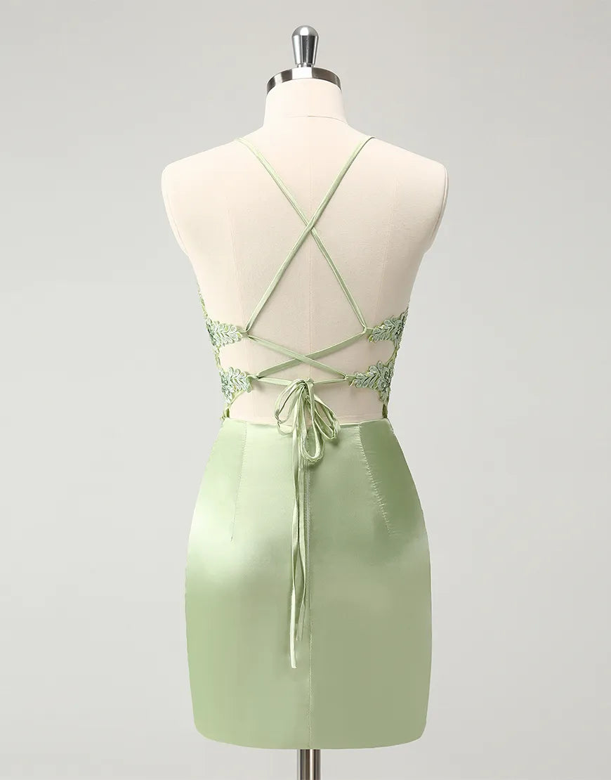 Back view of a green beaded formal dress with appliques.